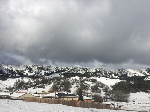 Scenic view of snowy hills